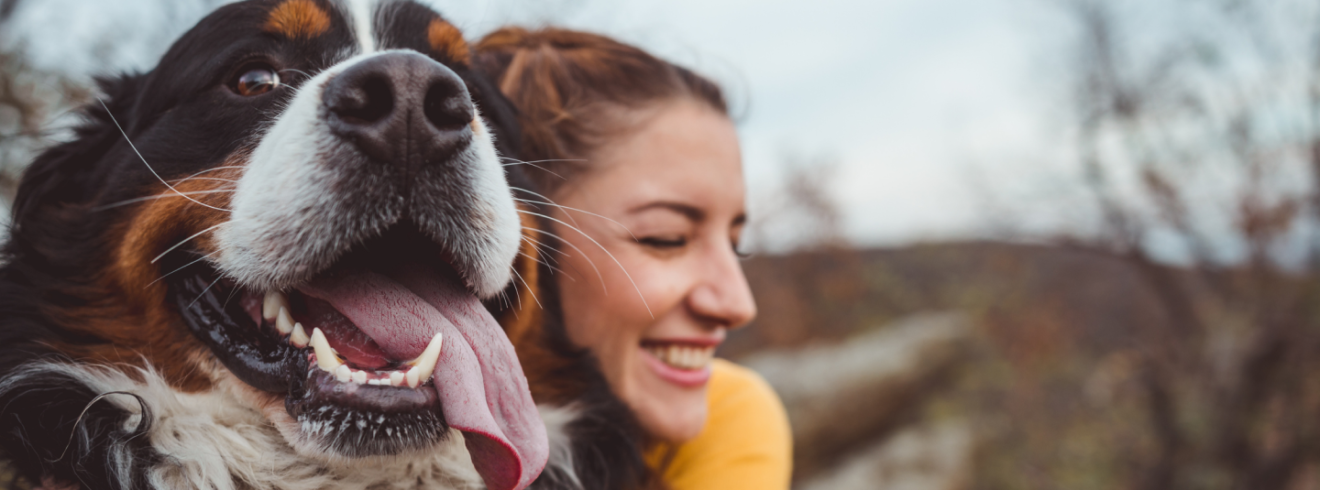 image of a woman and her happy dog